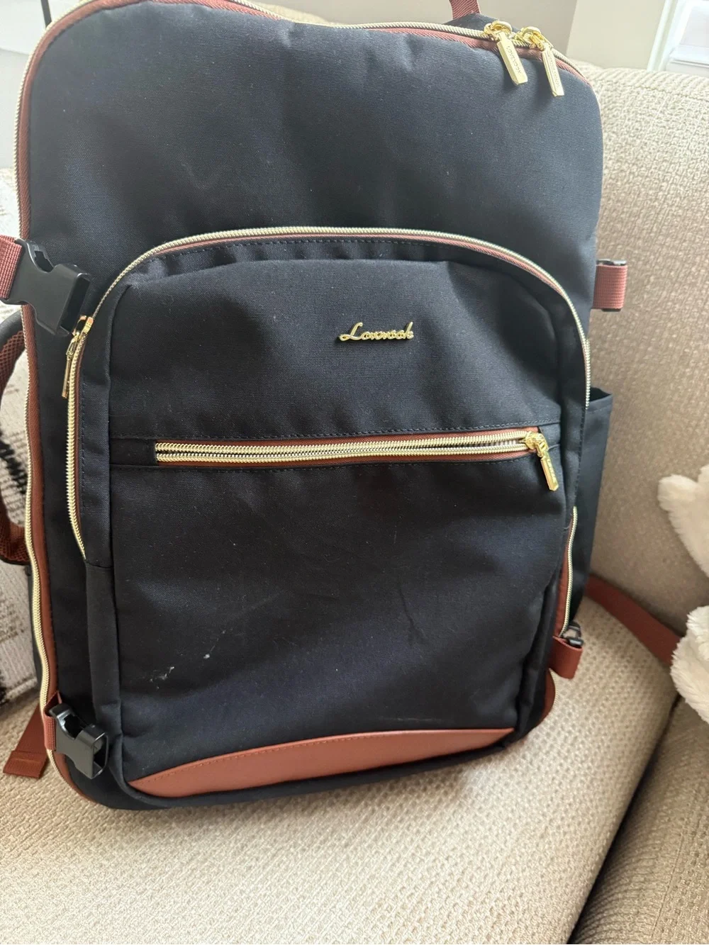 Black and Brown Men's Backpack with Gold Hardware